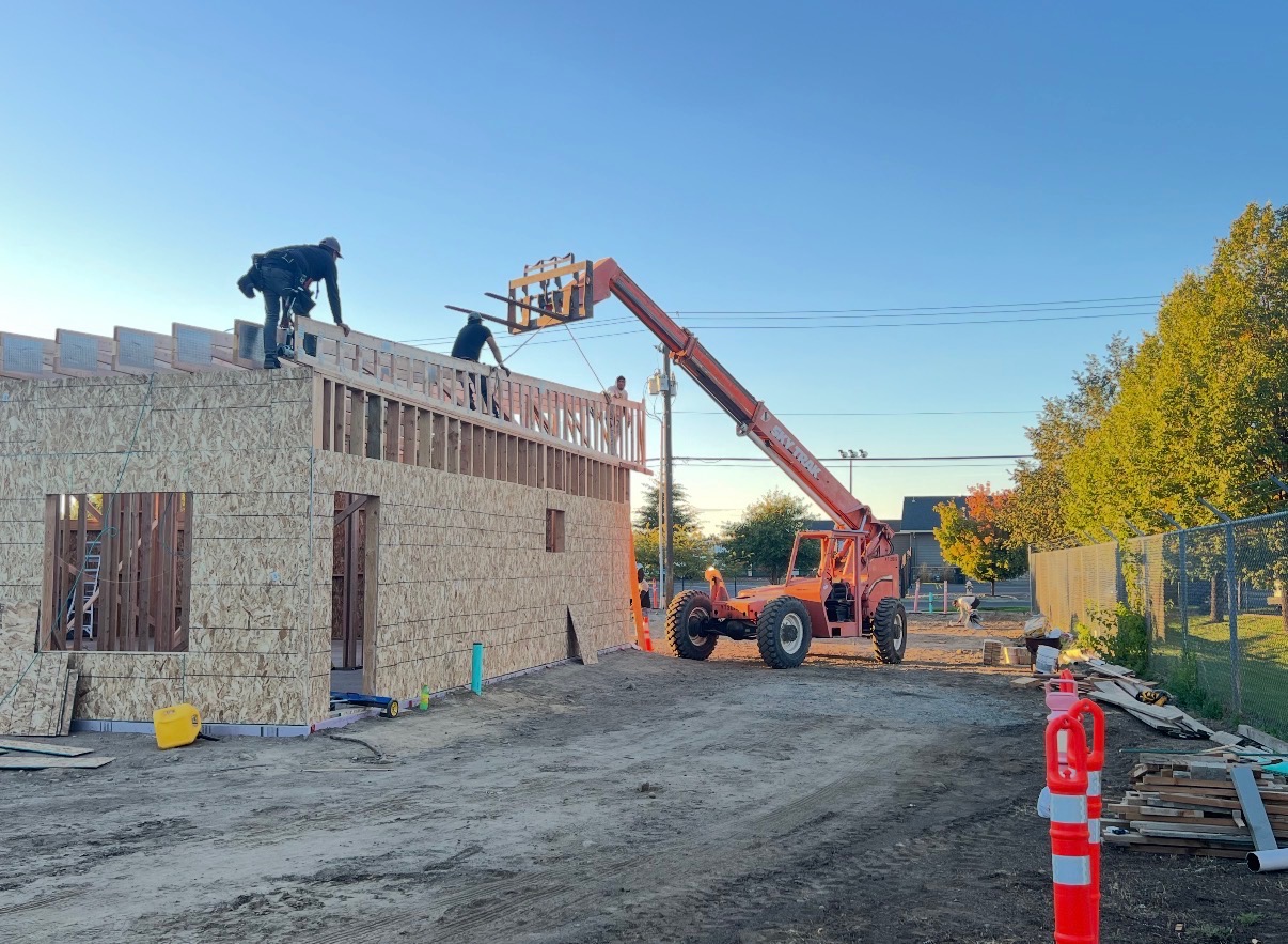 New commercial construction framing with Pina's crew on the roofline