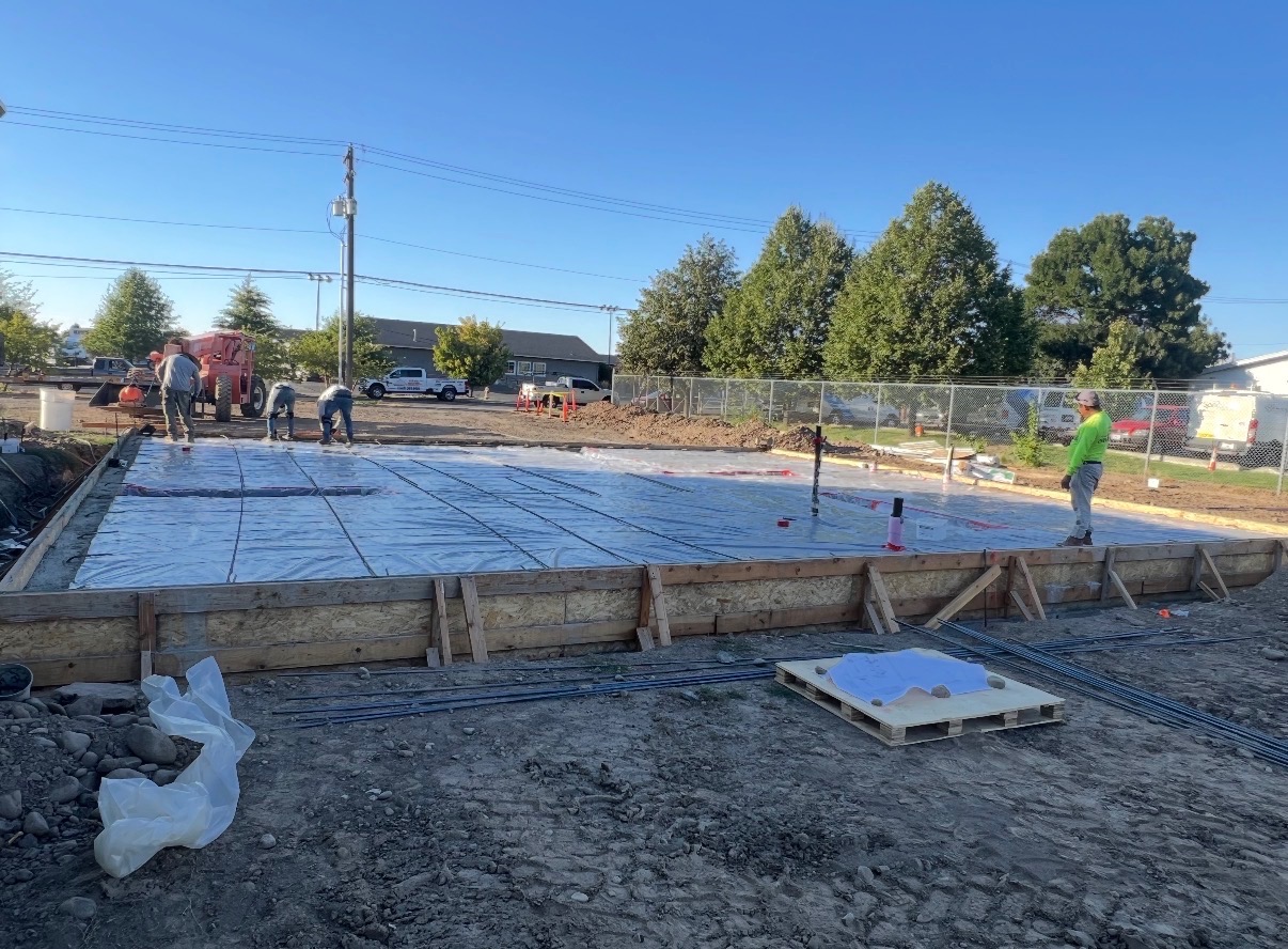 Slab foundation prep with vapor barrier and rebar on a new build