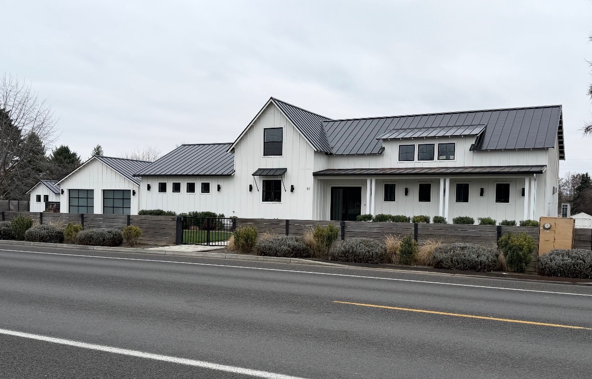 Modern farmhouse with standing seam metal roof completed by Pina's Roofing